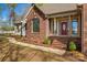 Detailed view of a brick home's entrance with a brick walkway and decorative columns at 620 St Lukes Church Rd, Salisbury, NC 28146
