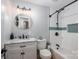 Charming bathroom featuring a modern vanity, round mirror, and tiled shower with a glass door at 706 Annieline Dr, Shelby, NC 28152