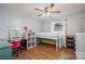 Well-lit bedroom offering a twin loft bed over a desk and shelving on hardwood floor at 706 Annieline Dr, Shelby, NC 28152