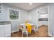 Bright dining area with a round table, four chairs, and a window offering natural light at 706 Annieline Dr, Shelby, NC 28152