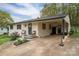 Charming single-story home with covered parking, well-maintained landscaping, and an inviting front porch at 706 Annieline Dr, Shelby, NC 28152