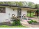 Attractive front porch with brick accents, comfortable wicker seating, and manicured landscaping at 706 Annieline Dr, Shelby, NC 28152