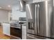 This kitchen features stainless steel appliances, a modern range hood, and sleek countertops at 706 Annieline Dr, Shelby, NC 28152