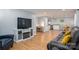 Open-concept living area with hardwood floors, white cabinets, and comfortable seating at 706 Annieline Dr, Shelby, NC 28152