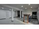 Spacious basement features a rustic bar area and a cozy brick fireplace at 923 Wyke Rd, Shelby, NC 28150