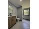 Bathroom features a modern vanity, toilet, large mirror and walk in shower at 923 Wyke Rd, Shelby, NC 28150
