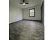 This is a bedroom with gray-trimmed windows and door with gray wood-look floors at 923 Wyke Rd, Shelby, NC 28150