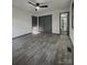 Bedroom showing closet, ceiling fan, wood-look floors, and bathroom access at 923 Wyke Rd, Shelby, NC 28150