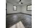 Bedroom featuring ceiling fan, wood-look floors, light walls, and windows overlooking wooded area at 923 Wyke Rd, Shelby, NC 28150