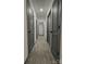Hallway featuring gray doors, white walls and gray wood-look floors at 923 Wyke Rd, Shelby, NC 28150
