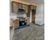 Kitchen area with stainless steel oven and microwave, shaker cabinets, and a geometric tile backsplash at 923 Wyke Rd, Shelby, NC 28150