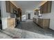 Modern kitchen features stainless appliances, ample cabinet space, and stylish gray wood-look floors at 923 Wyke Rd, Shelby, NC 28150