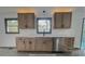 Modern kitchen featuring stainless dishwasher, modern fixtures, white counters, and updated cabinets at 923 Wyke Rd, Shelby, NC 28150