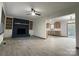Bright living room featuring hardwood floors, built-in shelves, and seamless flow into an open concept kitchen at 923 Wyke Rd, Shelby, NC 28150