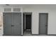Basement area includes storage with gray doors and white walls at 923 Wyke Rd, Shelby, NC 28150