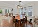 Dining area with a rustic light fixture, perfect for Gathering meals or entertaining friends with view to Living Room at 925 E 35Th St, Charlotte, NC 28205