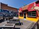 Stus Barrel House featuring a colorful mural, outdoor seating, and inviting firepit at 925 E 35Th St, Charlotte, NC 28205