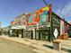 The colorful facade of the movie theater with adjacent restaurants is eye-catching at 925 E 35Th St, Charlotte, NC 28205