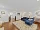 Bright living room with hardwood floors, neutral walls, and an open layout leading to the kitchen at 925 E 35Th St, Charlotte, NC 28205