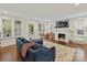 Cozy living room with fireplace and hardwood floors, perfect for entertaining guests or relaxing at home at 925 E 35Th St, Charlotte, NC 28205