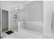 Bright bathroom featuring a soaking tub and a glass shower, with modern fixtures at 925 Westmere Ave, Charlotte, NC 28208