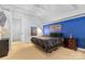 Cozy bedroom with industrial style ceiling, minimalist design and an accent wall at 925 Westmere Ave, Charlotte, NC 28208