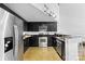 Contemporary kitchen with stainless steel appliances, black cabinetry, and sleek design at 925 Westmere Ave, Charlotte, NC 28208