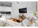 Spacious living area with TV, sectional sofa, leading to kitchen with bar seating at 925 Westmere Ave, Charlotte, NC 28208
