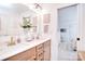 Well-lit bathroom featuring double sinks, quartz countertops, and stylish decor at 966 Scotch Meadows Loop, Monroe, NC 28110