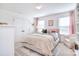 Cozy bedroom with neutral tones, plush bedding, and bright natural light at 966 Scotch Meadows Loop, Monroe, NC 28110