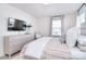 Relaxing bedroom with soft lighting, a dresser, and a beautifully made bed at 966 Scotch Meadows Loop, Monroe, NC 28110