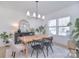 Bright dining room with natural light, wooden table, and stylish decor at 966 Scotch Meadows Loop, Monroe, NC 28110