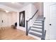 Bright entryway with a staircase, luxury vinyl plank flooring, and modern decor at 966 Scotch Meadows Loop, Monroe, NC 28110