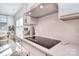 Bright kitchen with modern appliances, white cabinets, and a sleek cooktop at 966 Scotch Meadows Loop, Monroe, NC 28110