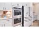 Modern kitchen showcases stainless steel appliances with white cabinets and stylish hardware at 966 Scotch Meadows Loop, Monroe, NC 28110