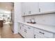 Elegant kitchen with white cabinets, quartz countertops, and stainless steel appliances at 966 Scotch Meadows Loop, Monroe, NC 28110
