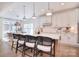 Modern kitchen with white cabinetry, quartz countertops, and stylish bar seating at 966 Scotch Meadows Loop, Monroe, NC 28110