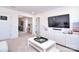 Living room with a TV and access to a hallway and other rooms in the home at 966 Scotch Meadows Loop, Monroe, NC 28110