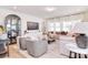 Bright and airy living room with neutral tones, stylish furniture, and large windows at 966 Scotch Meadows Loop, Monroe, NC 28110