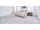 Spacious main bedroom with plush carpet, natural light, and stylish decor at 966 Scotch Meadows Loop, Monroe, NC 28110