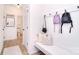 Bright mudroom with a built-in bench, hooks, and access to a half bathroom at 966 Scotch Meadows Loop, Monroe, NC 28110