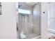 Contemporary glass-enclosed shower featuring neutral tile and a built-in niche at 966 Scotch Meadows Loop, Monroe, NC 28110