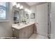 Modern bathroom with a double sink vanity, quartz countertops, and neutral-toned cabinetry at 9842 Quercus Ln, Huntersville, NC 28078