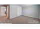 Bright, unfurnished bedroom with carpeted floors, neutral paint, and a closet at 9842 Quercus Ln, Huntersville, NC 28078