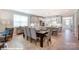 Dining area featuring a large table and seating with an open view of the kitchen and living room at 9842 Quercus Ln, Huntersville, NC 28078