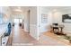Inviting hallway with wood floors leading to a bright, modern office space at 9842 Quercus Ln, Huntersville, NC 28078