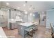 Contemporary kitchen with seating island, sleek cabinetry, and open access to the stairway at 9842 Quercus Ln, Huntersville, NC 28078