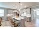 Modern kitchen boasts a center island with seating and stylish pendant lighting at 9842 Quercus Ln, Huntersville, NC 28078