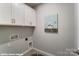 Functional laundry room area with storage cabinets and connections for laundry appliances at 9842 Quercus Ln, Huntersville, NC 28078