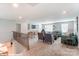 Large living room featuring comfortable seating, stylish decor, and plenty of natural light at 9842 Quercus Ln, Huntersville, NC 28078